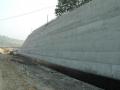 Securing of a slope before completing revetment