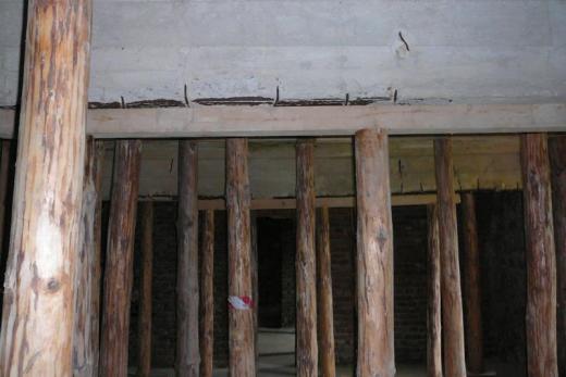Repair of cellar ceiling in World War II concentration camp barracks